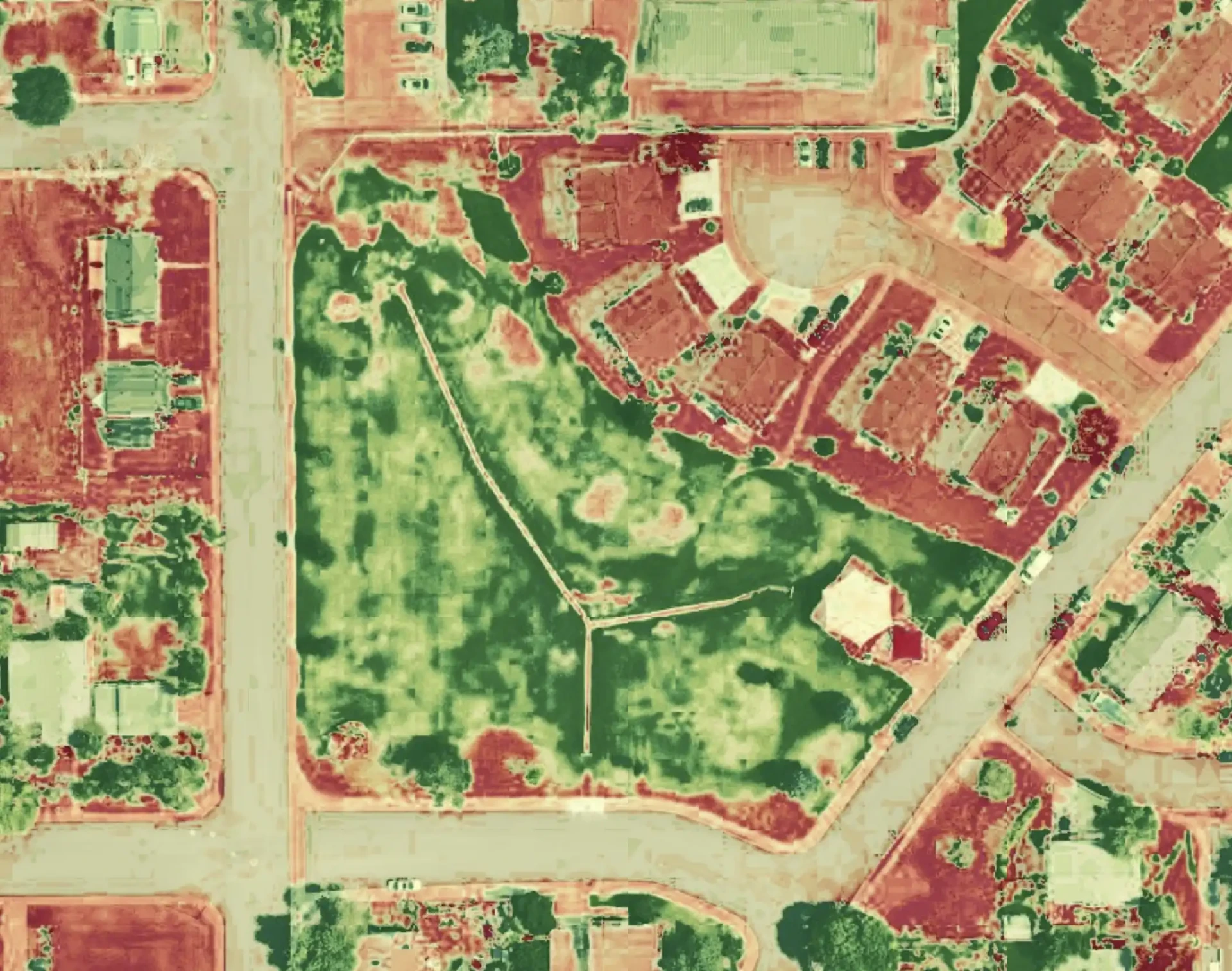 Plant health analysis map of a municipal park showing grass health variations across fields and surrounding properties